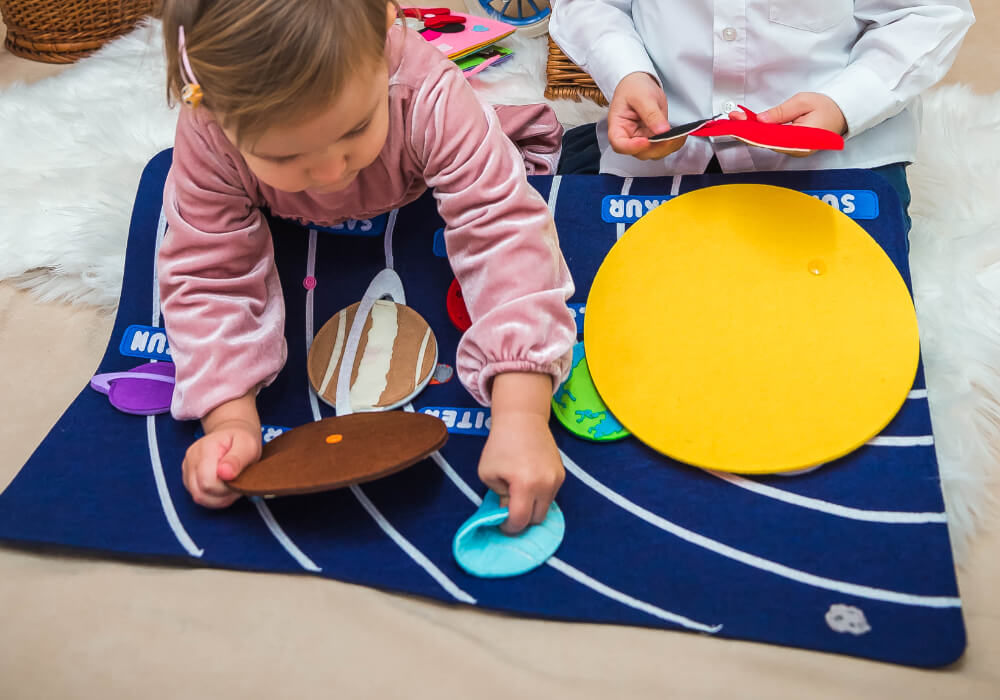 Astronaut Figure in Solar System Toy Set Astronaut figure as part of the solar system educational toy set for kids' exploration.