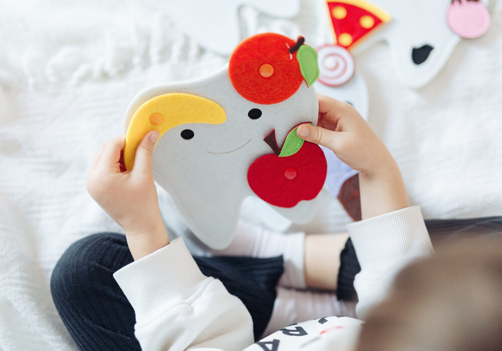 Interactive Tooth Toy for Kids' Dental Health Education Engaging interactive tooth toy designed for kids to learn about dental health and hygiene in a fun way